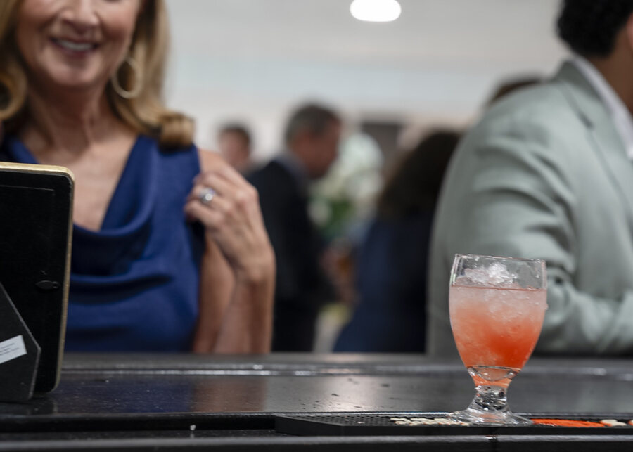 A guest with a cocktail at the bar