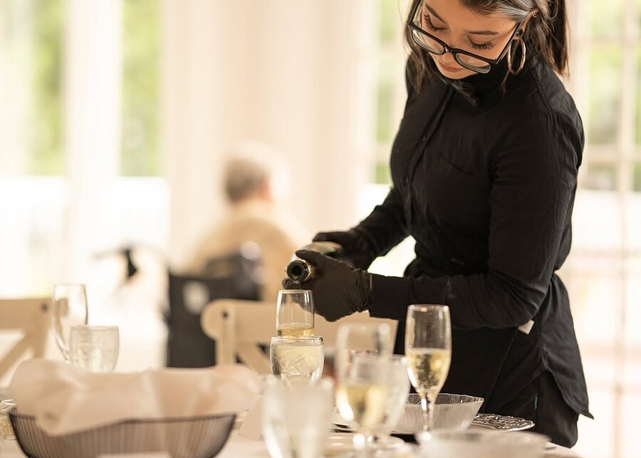 Server attending to guests